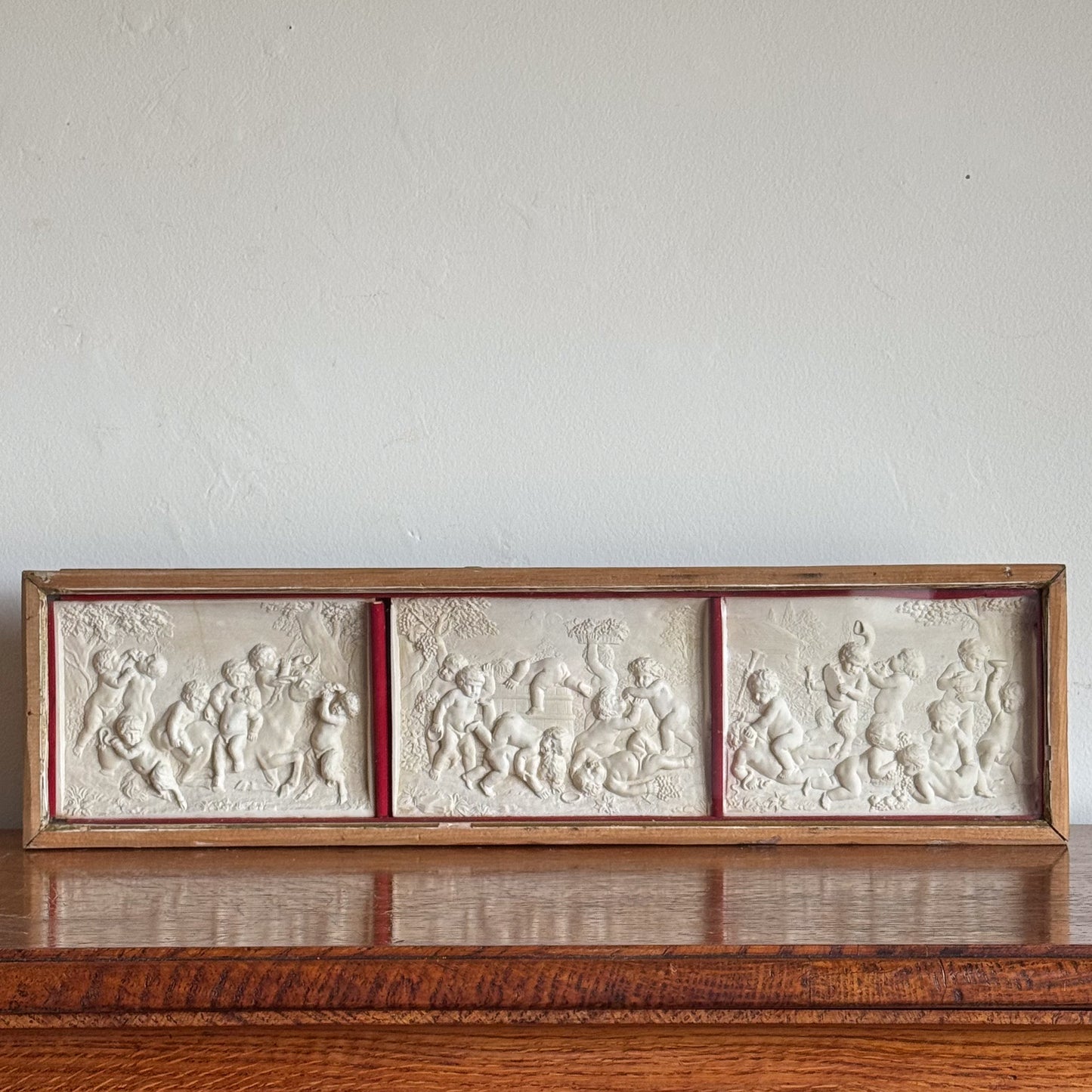 A Late 19th Century Framed Trio of Plaster Relief Plaques by Elkington & Co.
