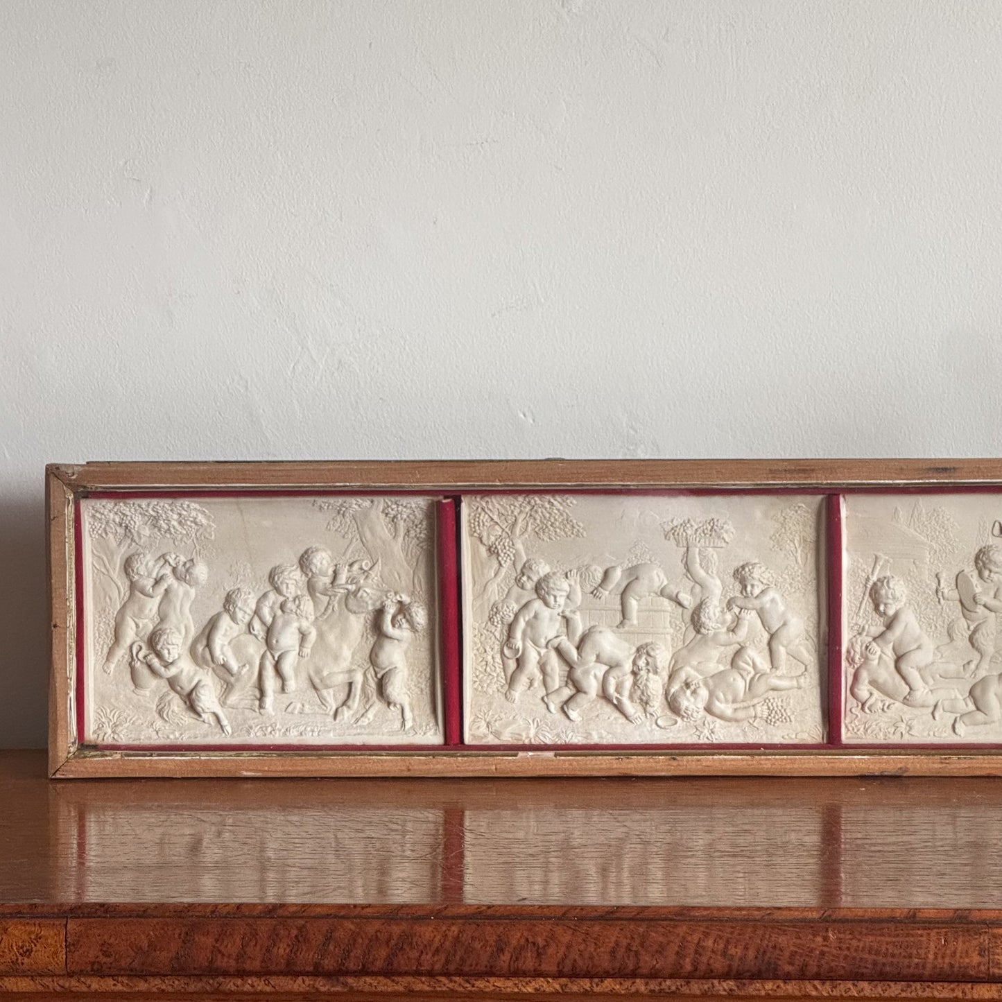 A Late 19th Century Framed Trio of Plaster Relief Plaques by Elkington & Co.