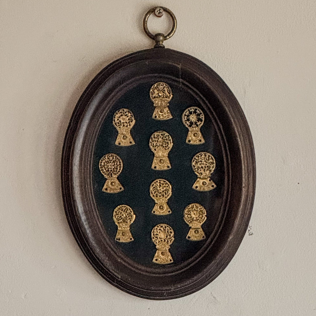 A Framed Collection of Antique Verge Watch Cocks