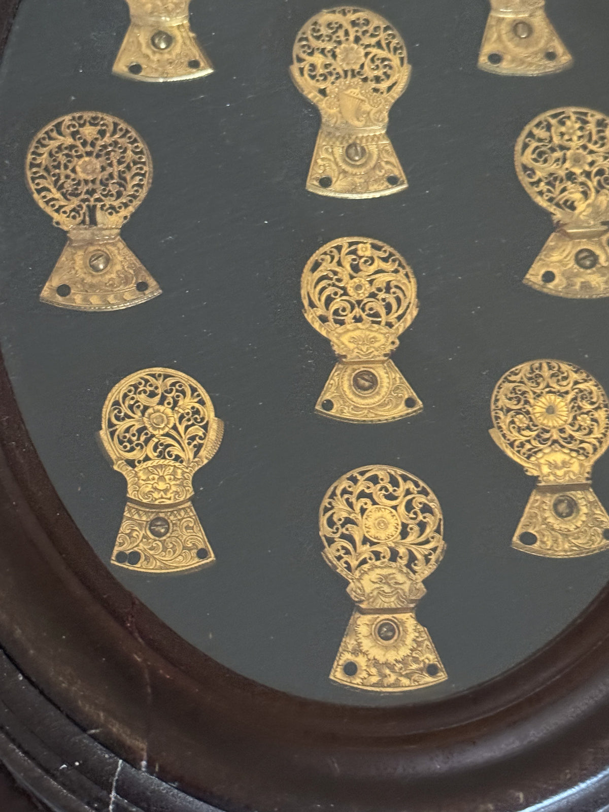 A Framed Collection of Antique Verge Watch Cocks